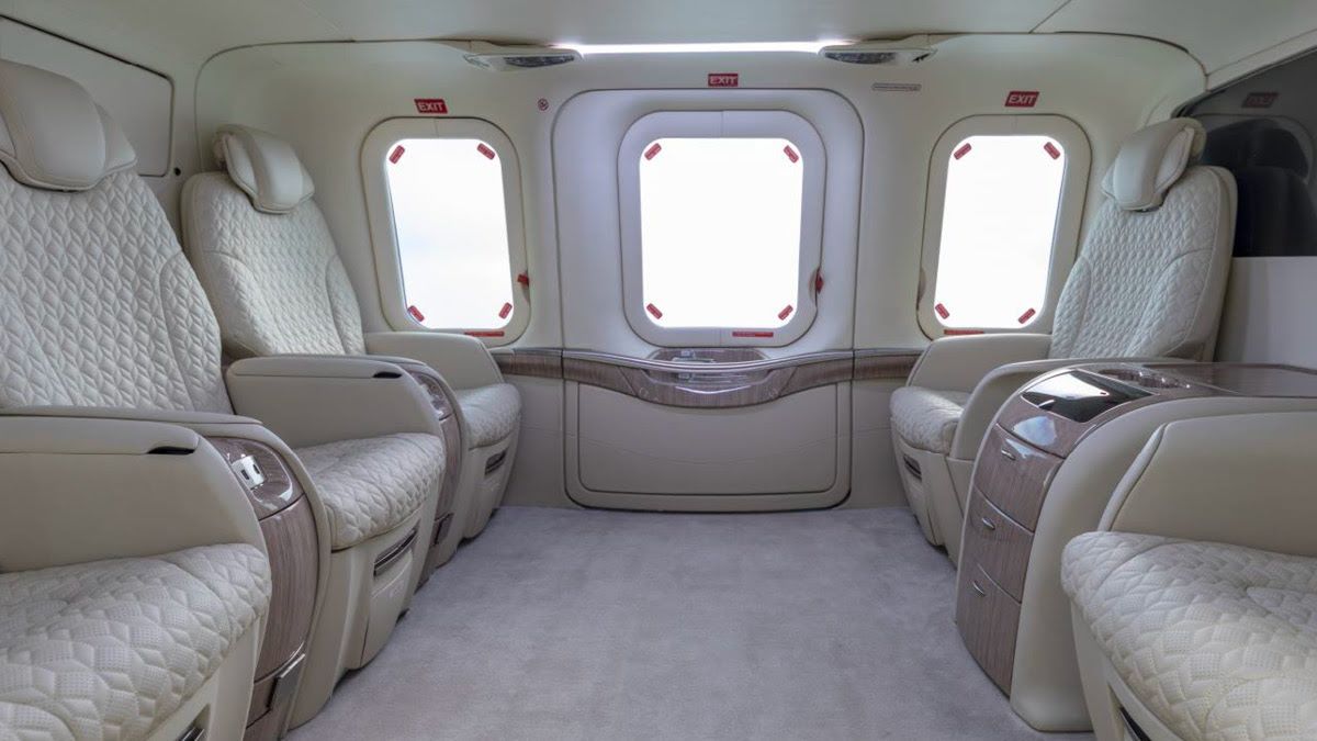 interior of AW139 executive cabin type with cream leather seats facing each other